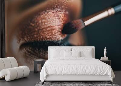 A detailed close-up image capturing the meticulous application of metallic bronze eyeshadow on an eyelid, highlighting the texture and gleam for a sophisticated look. Wall mural