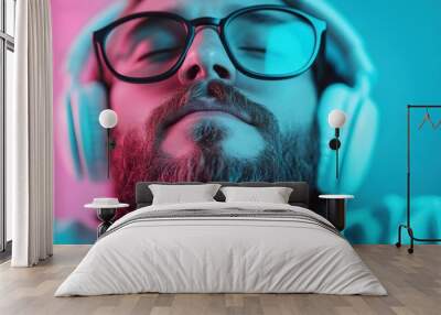 A man wearing headphones is set against a blue and pink gradient backdrop, merging the elements of modern technology and vibrant colors in a trendy aesthetic. Wall mural