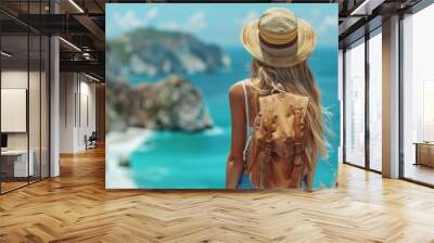 A travel-inspired image capturing a woman with straw hat viewing a stunning coastal scene, embodying wanderlust and adventure Wall mural