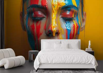 Striking image of a woman with brightly colored paint dripping down her face symbolizing creativity Wall mural