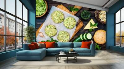 Raw ingredients for vegetarian dinner recipe. Preparing veggies cutlets or patties for burgers. Zucchini quinoa veggie burger with pesto sauce and sprouts. Top view, overhead, flat lay Wall mural