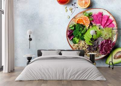 Vegan, detox Buddha bowl with quinoa, micro greens, avocado, blood orange, broccoli, watermelon radish, alfalfa seed sprouts. Top view, flat lay, copy space Wall mural