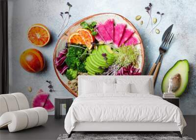 Vegan, detox Buddha bowl with quinoa, micro greens, avocado, blood orange, broccoli, watermelon radish, alfalfa seed sprouts. Top view, flat lay Wall mural