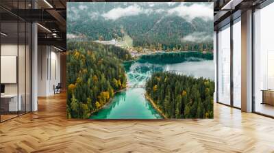 Autumn in the Bavarian mountains, Germany. Alps landscape with lake, bridge, clouds, forest, stones and reflection in turquoise water. View from above. Aerial drone outdoor photo. Wall mural