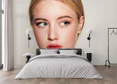 Portrait of beautiful blonde young woman face.  Spa model girl with fresh clean skin isolated on a white background Wall mural