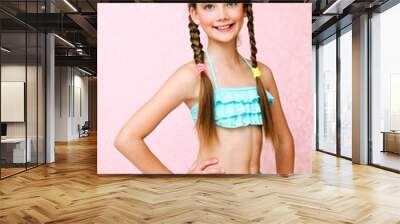 Portrait of cute smiling little girl child schoolgirl teenager in swimsuit isolated Wall mural