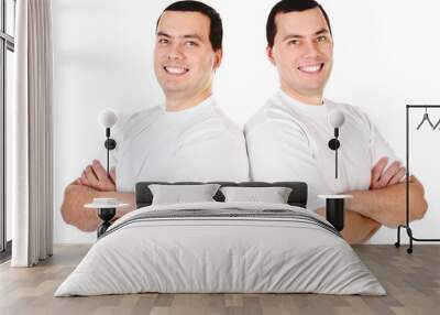 Two attractive positive smiling young men twins Wall mural