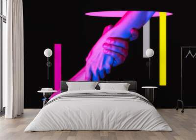 I will help you! Hands of a man and a woman in neon light. Art collage. Metaphor of rescue. Wall mural