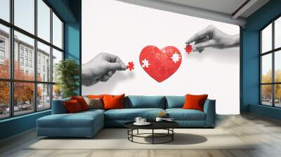 two people put together a heart-shaped puzzle. the concept of building love relationships. Wall mural