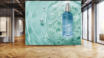 A glass blue bottle with a pipette with serum stands on the surface of blue water Wall mural