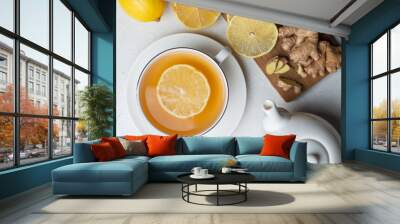 A cup of tea with lemon and ginger and mint Wall mural