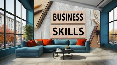 business skill two wood blocks on a wood table near a notebook Wall mural