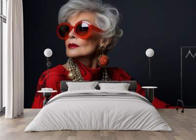 elderly woman in sunglasses. fashion and style in retirement. makeup and gray hair. adult grandmother in jewelry. Wall mural