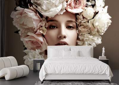 fashion model with large hairstyle and flowers in her hair. Wall mural