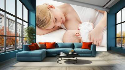 young mother breastfeeds her baby. breast-feeding. Wall mural