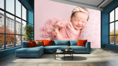 first photo shoot. newborn child. newborn.  the baby is lying on a pink blanket. newborn girl Wall mural