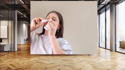 Daily nasal cleansing with sprays for congestion relief and rhinitis treatment. Effective nasal care for better breathing. Wall mural