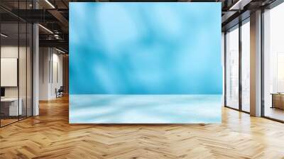 Abstract shadow on table top and blue wall background. Blurred backdrop with copy space. Wall mural