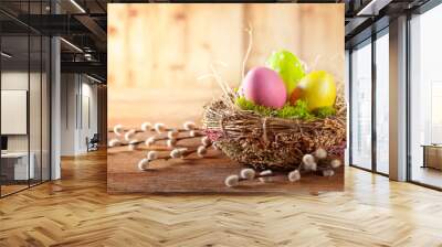 Easter composition with Easter eggs in nest and branches of pussy willows. Wall mural