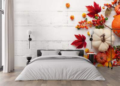 Festive autumn decor from pumpkins, berries and leaves on a white  wooden background. Concept of Thanksgiving day or Halloween. Flat lay autumn composition with copy space. Wall mural