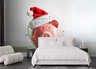 Festive Piggy Bank with Santa Hat and Holiday Lights for Christmas Savings Concept Wall mural