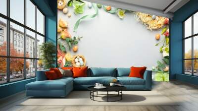 Happy Easter concept with easter eggs in nest and spring flowers. Easter background with copy space. Flat lay Wall mural