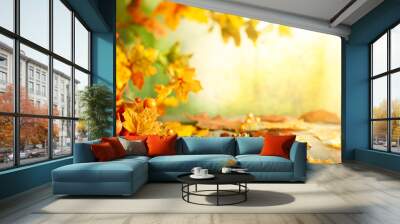 Thanksgiving or autumn scene with leaves and berries on wooden table.  Autumn background with falling leaves. Wall mural