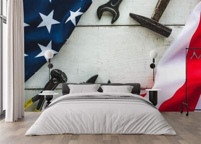 LABOR DAY. Hand tools and the Flag of the United States of America lying on the table. View from above, close-up. Congratulations to family, relatives, friends and colleagues. National holiday concept Wall mural