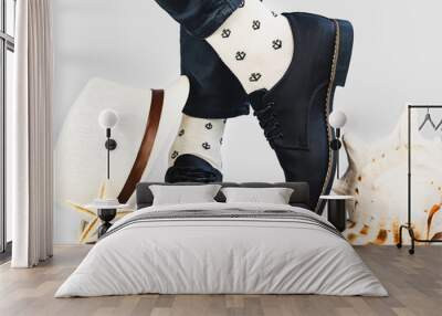 Men's legs, bright socks with a nautical theme and stylish shoes on a white, isolated background. Close-up. Concept of style, fashion and beauty Wall mural