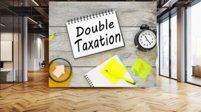 notebook. open notepad with text DOUBLE TAXATION Wall mural