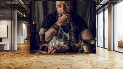 chef man cooking in rustic kitchen Wall mural