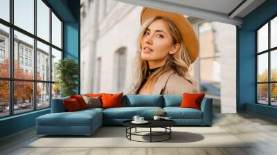 Close up  outdoor  portrait  of stylish blond woman with perfect wavy hairs in beige hat and casual suit. Full lenght. Wall mural