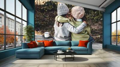 Two happy girls as friends hug each other. Little girlfriends in park. Children Friendship. Wall mural