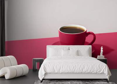 Cup of black coffee on color white and Viva Magenta background for contrast. Wall mural