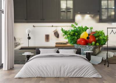 Modern kitchen with fresh vegetables on wooden tabletop, space for you and display products. Wall mural