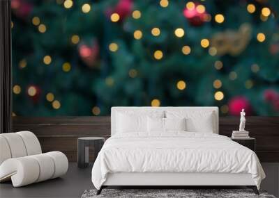 Wooden dark tabletop and blurred christmas tree bokeh. Xmas background for display your products. Wall mural