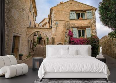 Traditional old stone houses on a street in the medieval town of Saint Paul de Vence, French Riviera, South of France Wall mural