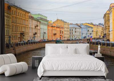 Waterfront buildings on the banks of river Neva and tourist boats on the water in Saint Petersburg Wall mural