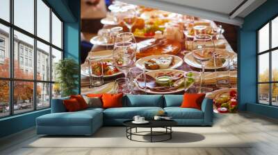 A group of people at a long table with food. The concept for the joint celebration of memorable dates or holidays Wall mural