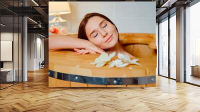 Healing spa treatment. Cedar barrel. Young beautiful girl. Health accessories. Salon procedure. Wall mural