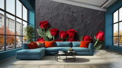 Red roses on a black, textured, stone background. Place for text, top view Wall mural