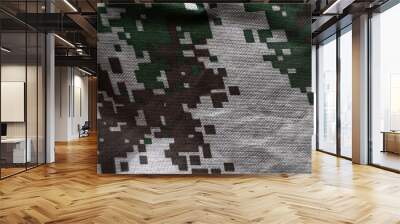 The texture of the khaki protective fabric. Pixel coloring on military clothing. Wall mural