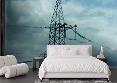 High voltage towers with sky background. Power line support with wires for electricity transmission. High voltage grid tower with wire cable at distribution station. Energy industry, energy saving Wall mural