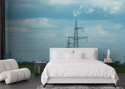 High voltage towers with sky background. Power line support with wires for electricity transmission. High voltage grid tower with wire cable at distribution station. Energy industry, energy saving Wall mural