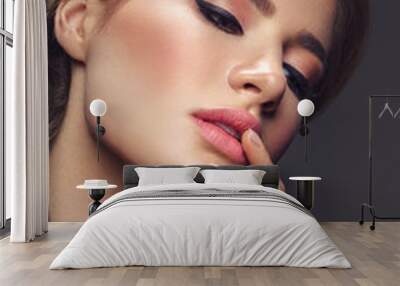 Beautiful girl with cat eye make-up Wall mural