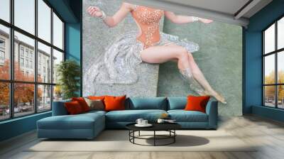 The girl has a beautiful graceful chiseled figure. Woman posing at the exit of the pool water. A beautiful lady mermaid comes out of the clear blue water. Wall mural