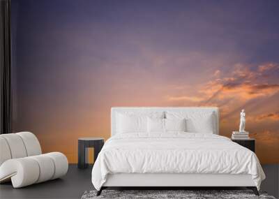 Early sunny morning and the dawn sun with rays on a few clouds. Wall mural