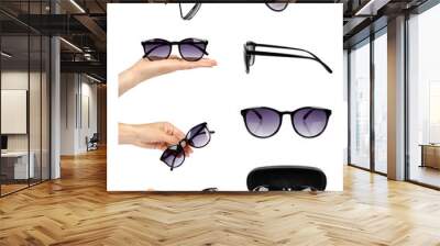 set of different Stylish plastic sunglasses with hand isolated on white background. Wall mural