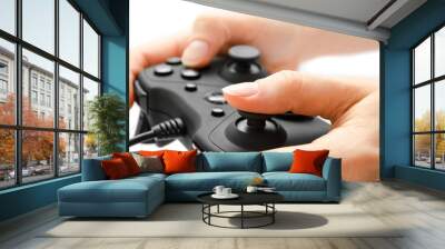 woman hand holding gamepad. Wall mural