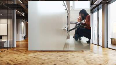 African American male watching the baking of biscuit with his daughter Wall mural